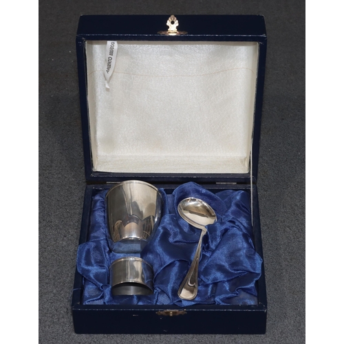 435 - A Continental 800 silver coloured metal beaker, napkin ring and child's spoon in fitted blue case, 2... 