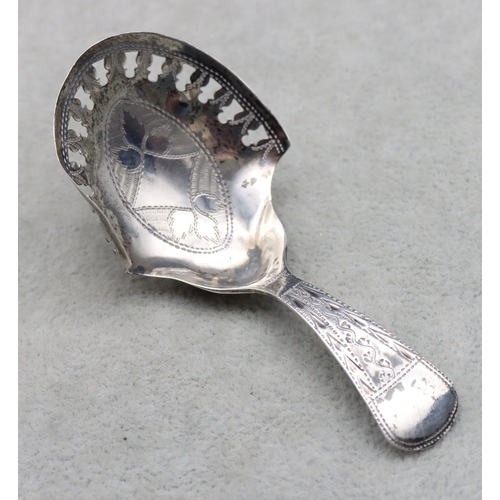 436 - A George III silver caddy spoon with pierced bowl and engraved Birmingham 1911, maker Joseph Taylor