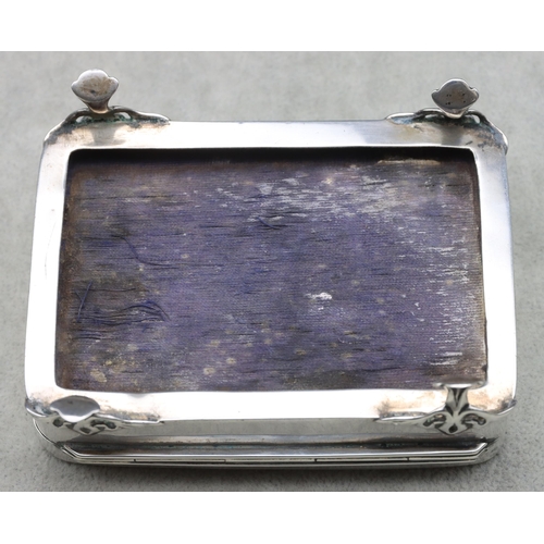 440 - An Edward VII silver rectangular trinket box with hinged lid, embossed floral and scroll decoration,... 