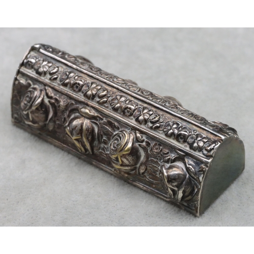 441 - A Continental silver coloured rectangular shaped container with hinged end with allover embossed flo... 