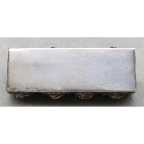 441 - A Continental silver coloured rectangular shaped container with hinged end with allover embossed flo... 