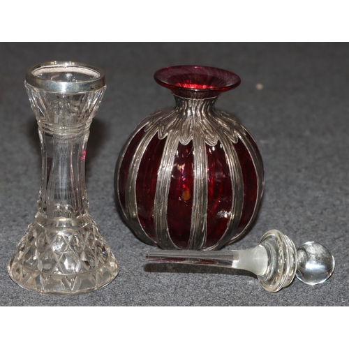 444 - A ruby and clear glass round bulbous thin necked scent bottle with part silver covering, 12cm high a... 