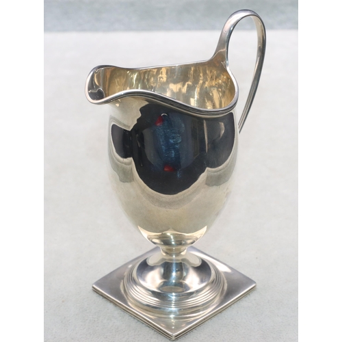 458 - An Edward VII silver cream jug on square base, London 1901, 13cm high, 3oz