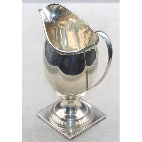 458 - An Edward VII silver cream jug on square base, London 1901, 13cm high, 3oz