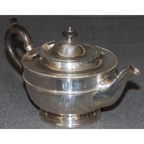 459 - A George V silver round bulbous shaped teapot with ebony finial and handle, London 1919, maker Golds... 