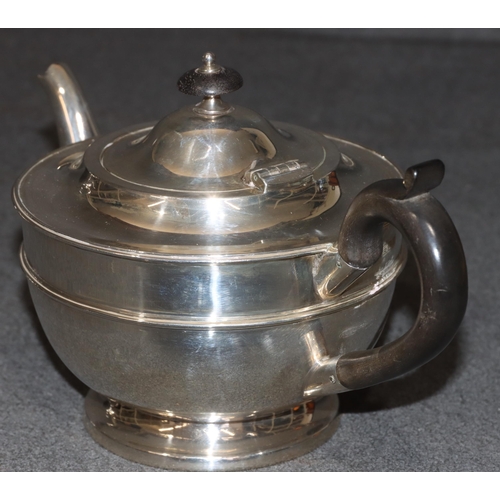 459 - A George V silver round bulbous shaped teapot with ebony finial and handle, London 1919, maker Golds... 