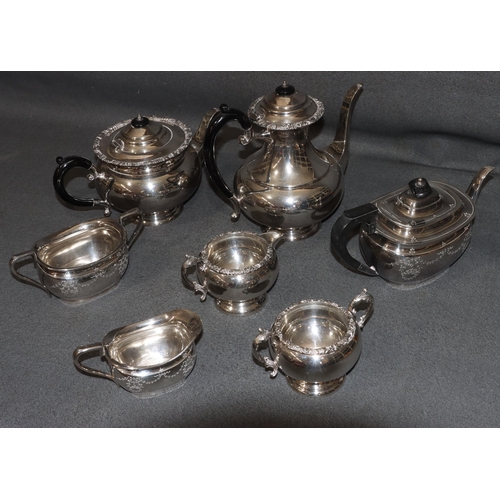 468 - A 4-piece silver plated round bulbous shaped tea and coffee service with black scroll handles and fi... 