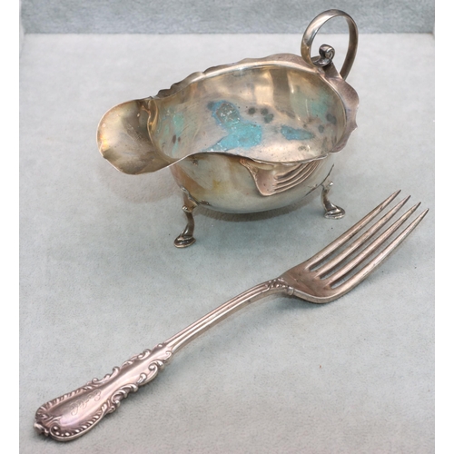 469 - A Birmingham silver sauce boat with crinkle handle on splayed hoof feet and a sterling silver fork, ... 