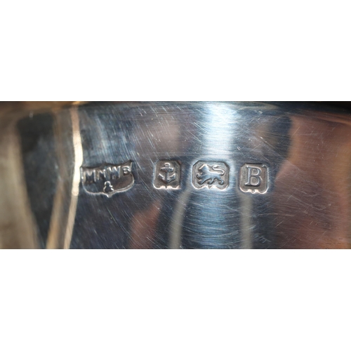 469 - A Birmingham silver sauce boat with crinkle handle on splayed hoof feet and a sterling silver fork, ... 