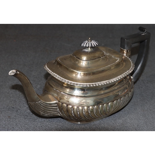 470 - An Edward VII silver rectangular bulbous shaped tea service with half embossed reeded decoration, co... 