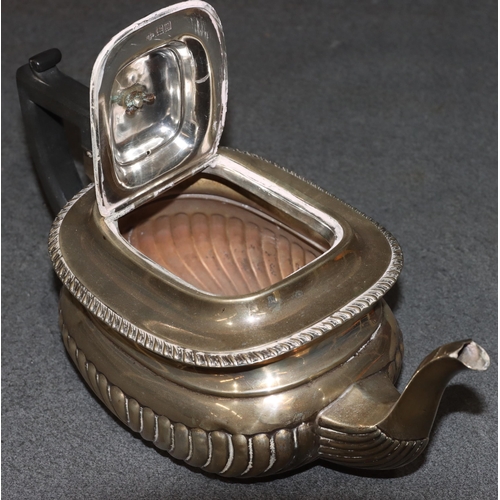 470 - An Edward VII silver rectangular bulbous shaped tea service with half embossed reeded decoration, co... 