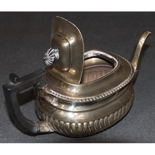 470 - An Edward VII silver rectangular bulbous shaped tea service with half embossed reeded decoration, co... 