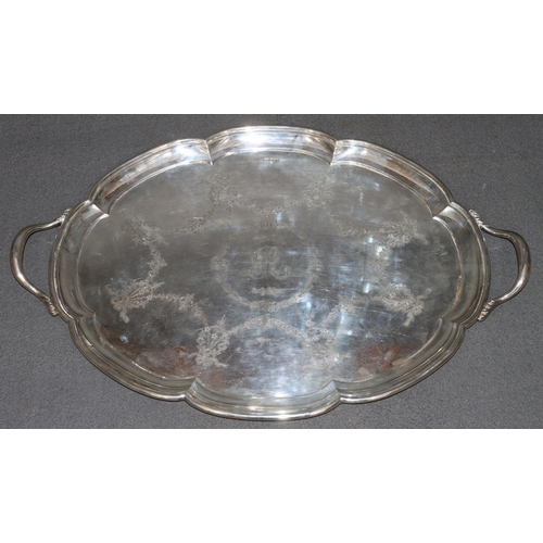 472 - A George V large 2-handled silver scallop shaped tray with engraved swag, ribbon and floral decorati... 