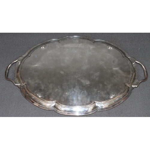 472 - A George V large 2-handled silver scallop shaped tray with engraved swag, ribbon and floral decorati... 