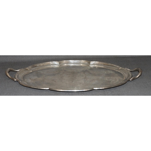 472 - A George V large 2-handled silver scallop shaped tray with engraved swag, ribbon and floral decorati... 