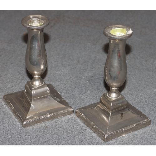 494 - A pair of Continental dwarf candlesticks on turned stems with square splayed bases, 16cm high