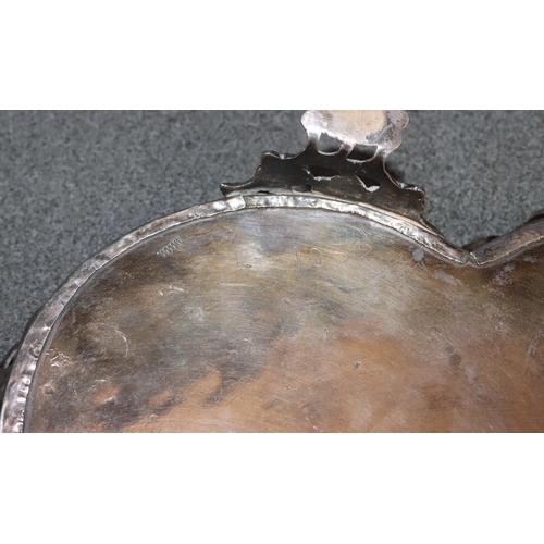 495 - A Continental silver coloured metal 2-handled scallop shaped tray with embossed and pierced floral g... 