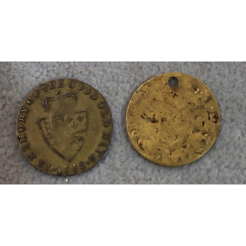 709 - A George III gold Third Guinea (worn and hole drilled), 3.8 grams and an 18th Century George III Tok... 