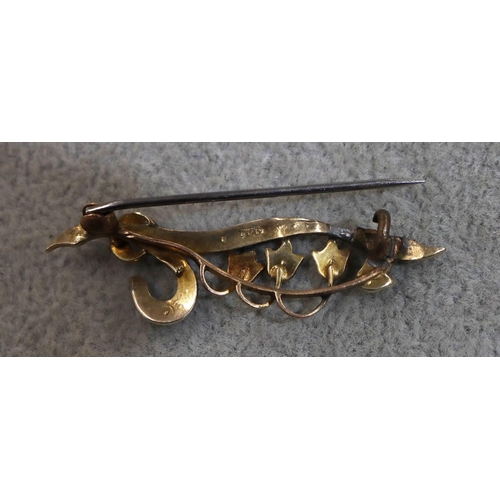 712 - A small 9ct gold brooch set with half pearls, 1.9 grams gross