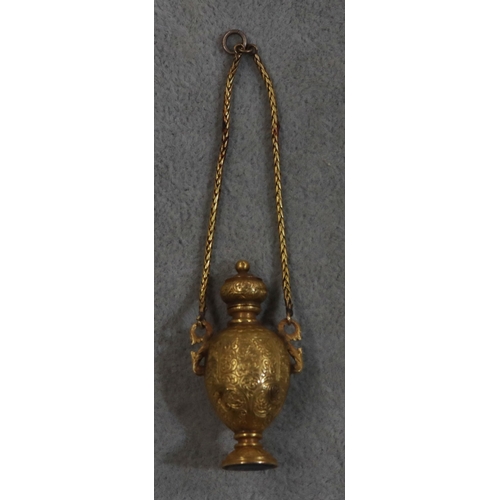 748 - A gold pendant snuff bottle/seal in the form of an urn with hinged lid with allover engraved scroll ... 