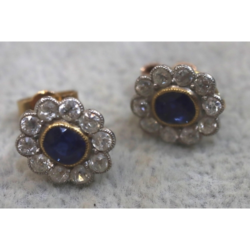 756 - A pair of 9ct gold oval cluster earrings set with centre sapphires, each surrounded by 10 diamonds, ... 