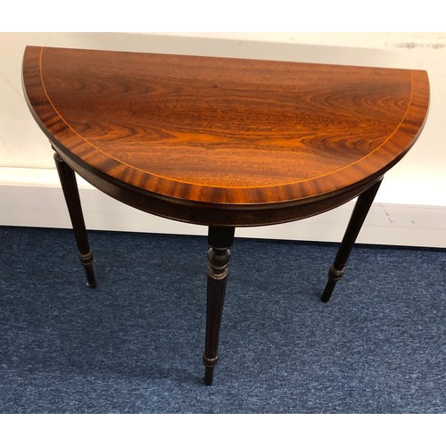 1404 - A reproduction mahogany demi-lune side table, 76cm wide, 36.5cm deep, 76cm high.