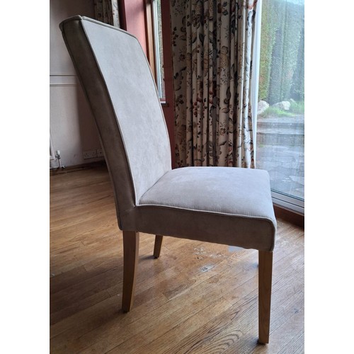 1406 - A set of 4 dining chairs with light grey suede effect fabric seats and backs.