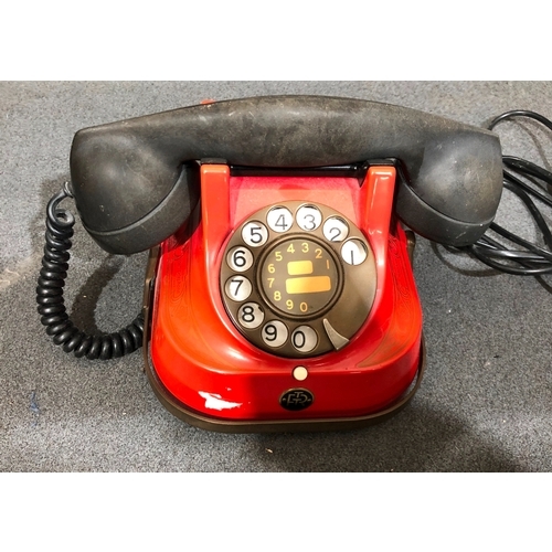 1218 - A vintage red bell telephone (RTT 56) and a brass warming pan, 116cm long.