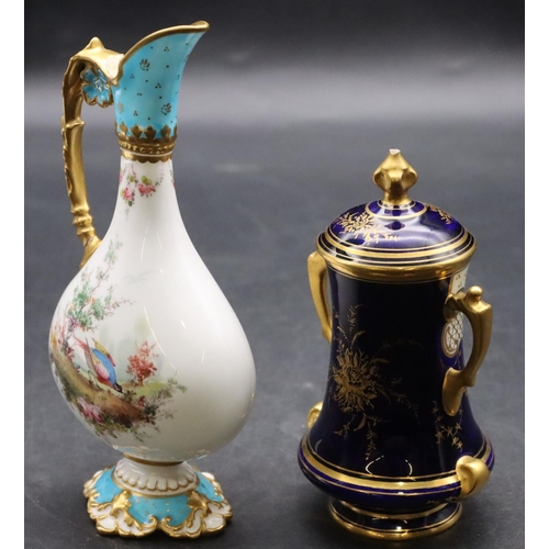 1408 - A Coalport small bulbous 2-handled lidded pot on blue and cream ground with landscape and gilt decor... 