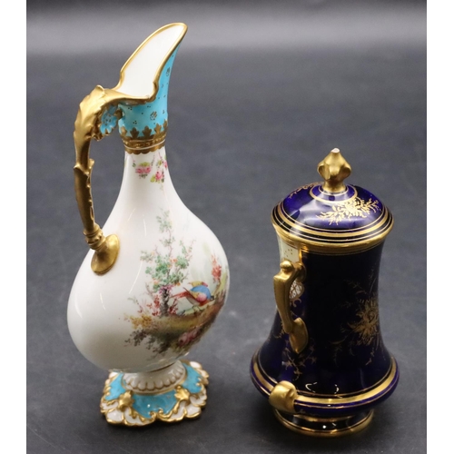 1408 - A Coalport small bulbous 2-handled lidded pot on blue and cream ground with landscape and gilt decor... 