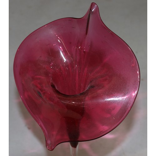 179 - A Victorian ruby and clear glass vase in form of a trumpet shaped flower 32cm high