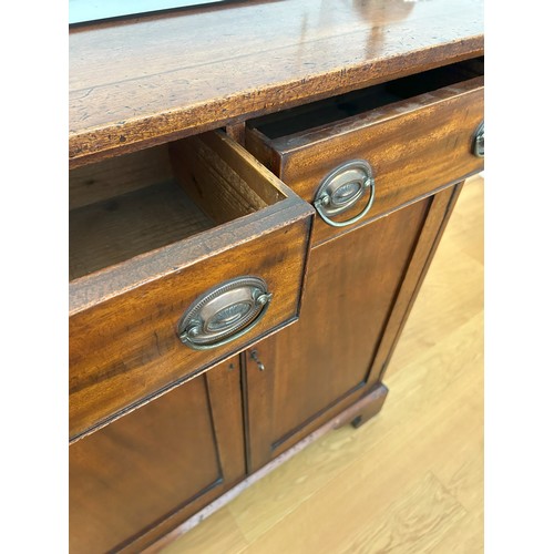 1412 - A 19th Century mahogany side cabinet with 2 drawers, brass pull handles and 2 panel doors enclosing ... 