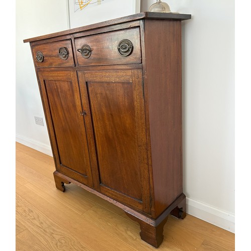 1412 - A 19th Century mahogany side cabinet with 2 drawers, brass pull handles and 2 panel doors enclosing ... 