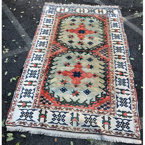 1415 - A Turkish wool rug, 237cm long, 138cm wide (some spot marks).