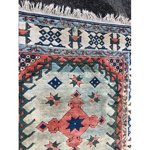 1415 - A Turkish wool rug, 237cm long, 138cm wide (some spot marks).