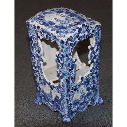 83 - A Continental Delft blue and white ornament in the form of a Sedan chair with allover floral, leaf a... 