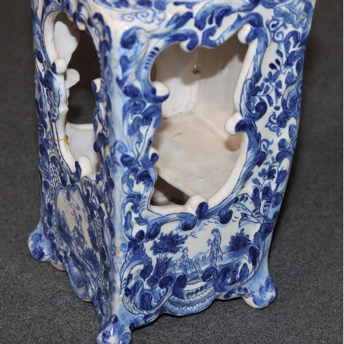 83 - A Continental Delft blue and white ornament in the form of a Sedan chair with allover floral, leaf a... 