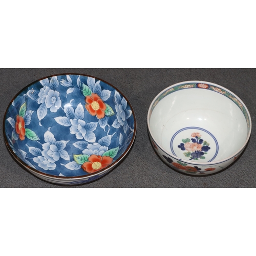 168 - An Imari round bowl on white ground with red, blue and green floral, leaf and gilt decoration (crack... 