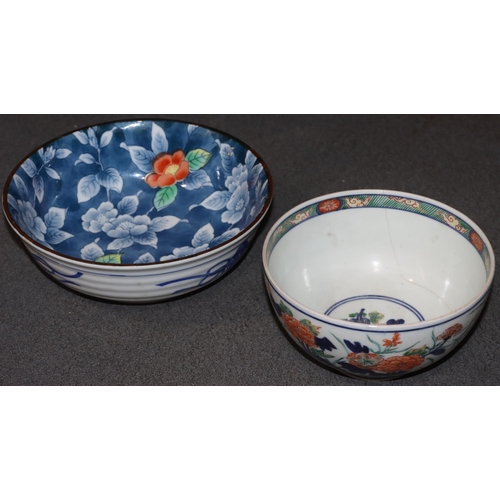 168 - An Imari round bowl on white ground with red, blue and green floral, leaf and gilt decoration (crack... 