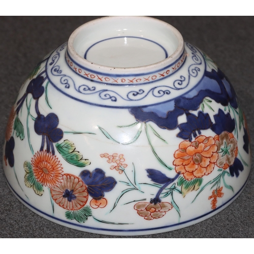 168 - An Imari round bowl on white ground with red, blue and green floral, leaf and gilt decoration (crack... 