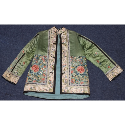 927 - A Chinese ladies' green silk short jacket with Mandarin collar, finely hand embroidered with allover... 