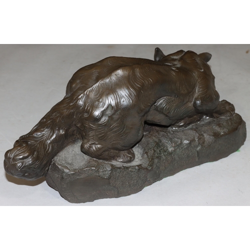 824 - A composition resin model of a fox after Bartelier, 39cm long, 18.5cm high