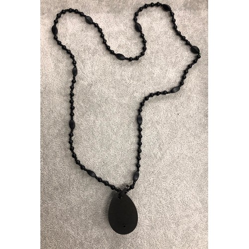 1268 - A  black beaded necklace 40cm long with pendant, 4cm long,