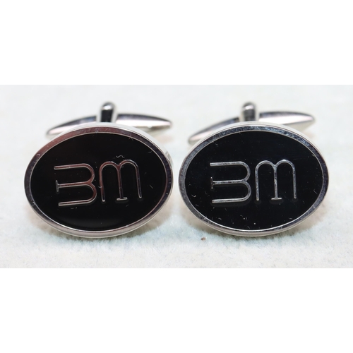 515 - A pair of Bargate Murray gentlemen's oval cufflinks with monogram motifs, in fitted leather case