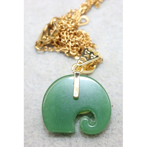 619 - A jade style pendant in the form of an elephant with chain