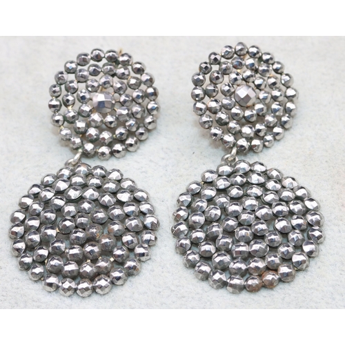 556 - A pair of Georgian cut steel large circular drop earrings, 6.5cm high (boxed)