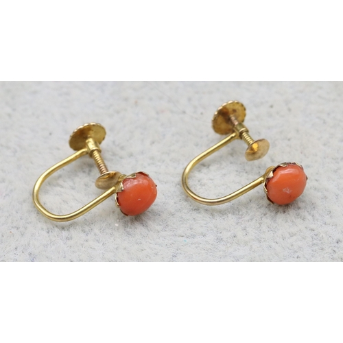 557 - A pair of 9ct gold coral earrings with screw backs, 0.9 grams gross (boxed)