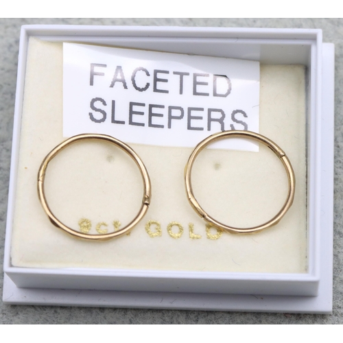 573 - A pair of 9ct gold sleeper earrings, 0.5 grams