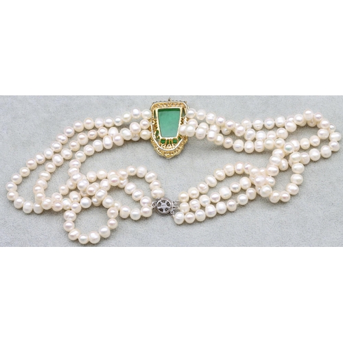 583 - A Freshwater pearl  3-row choker necklace with large gemstone setting