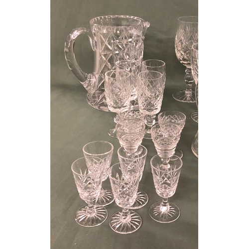 2002 - A quantity of various cut glass including a decanter, bowls, a jug and various glasses of different ... 